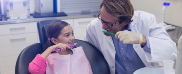 child visiting a pediatric dentist