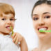 mom and child brushing teeth